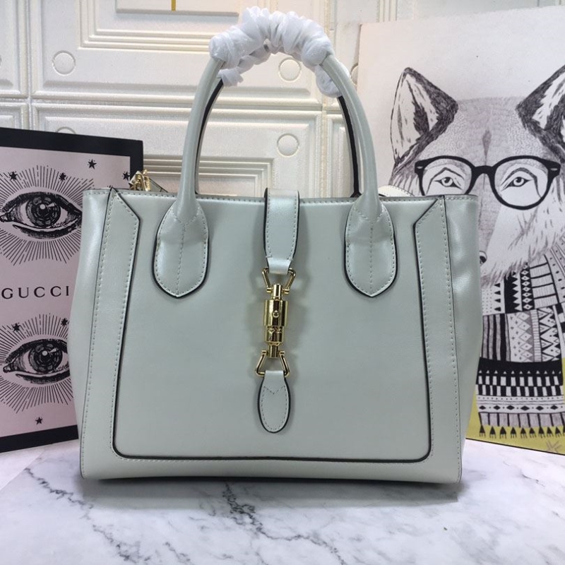 G*u*i shopping bags